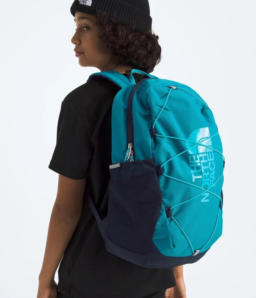 Person wearing a blue backpack.