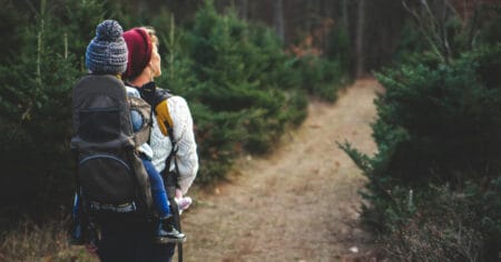 woman concerned about hiking safety carrying a child